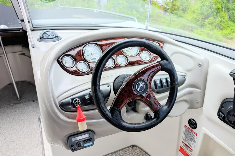 Slide: The Image of Steering console of a 2007 Monterey 248LS Montura Bowrider with gauges and controls. - 4