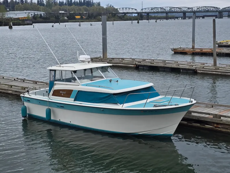 The Image of 1968 Tollycraft Royal Express boat docked at marina. - 0