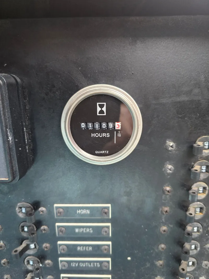 Slide: The Image of Hour meter on 1968 Tollycraft Royal Express showing 1109.3 hours. - 11