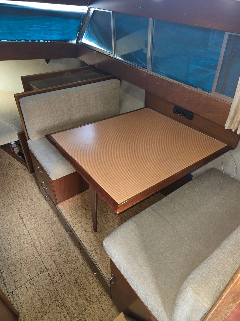 Slide: The Image of Interior of a 1968 Tollycraft Royal Express with dining area. - 18