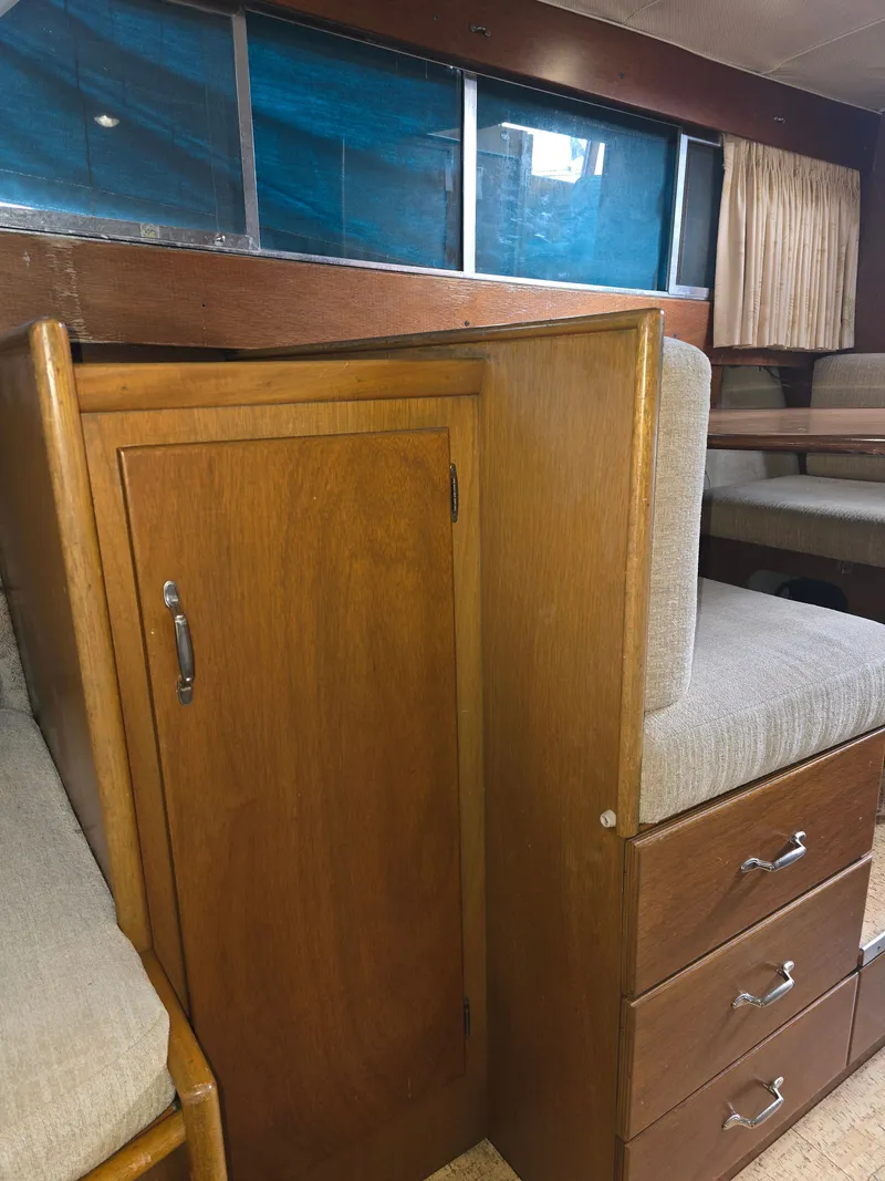 Slide: The Image of Interior of a 1968 Tollycraft Royal Express with wooden furnishings. - 22
