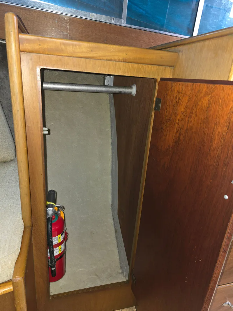 Slide: The Image of Interior of 1968 Tollycraft Royal Express with fire extinguisher. - 23