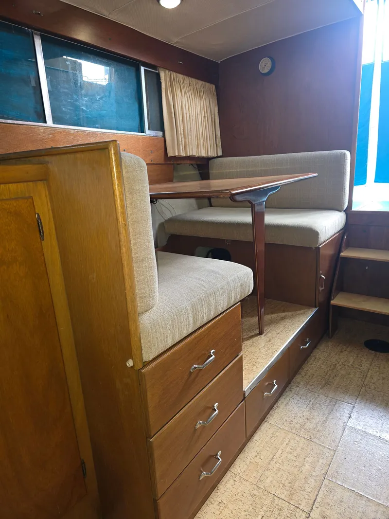 Slide: The Image of Interior of a 1968 Tollycraft Royal Express with wooden furnishings. - 24