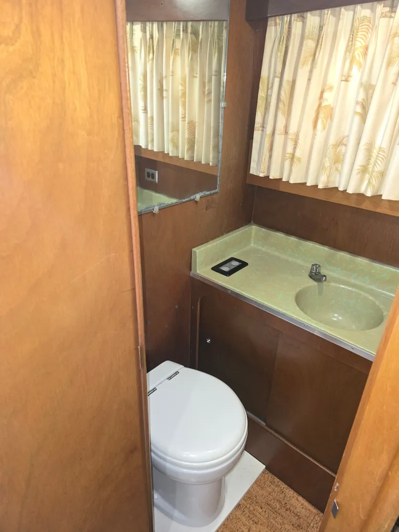 Slide: The Image of Interior of 1968 Tollycraft Royal Express featuring bathroom and sink. - 26