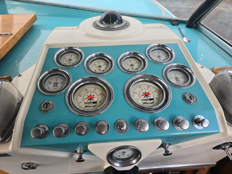 Slide: The Image of Dashboard of a 1968 Tollycraft Royal Express boat with gauges. - 6
