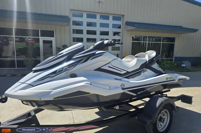 The Image of 2019 Yamaha WaveRunner FX Cruiser HO parked outside a building on a trailer. - 1
