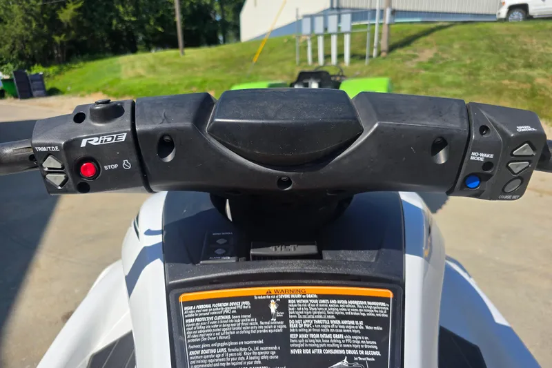 Slide: The Image of 2019 Yamaha WaveRunner FX Cruiser HO handlebars with control buttons and warning labels. - 9