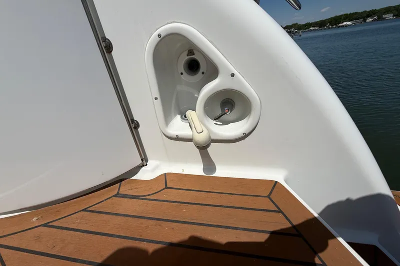 Slide: The Image of 2011 Formula 45 Yacht deck with water hose connection and wooden flooring. - 11