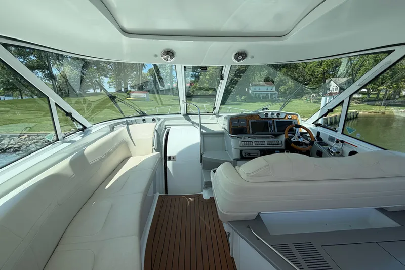 Slide: The Image of Interior view of a 2011 Formula 45 Yacht cockpit with luxurious seating and modern controls. - 16