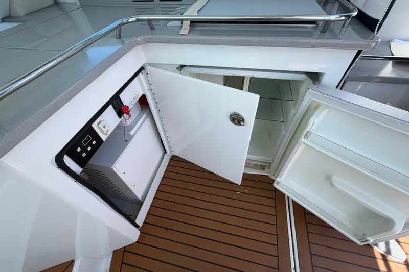 Slide: The Image of 2011 Formula 45 Yacht interior with open storage compartments and wooden flooring. - 22