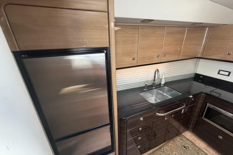 Slide: The Image of Modern kitchen interior of 2011 Formula 45 Yacht with sleek cabinetry and stainless steel appliances. - 28