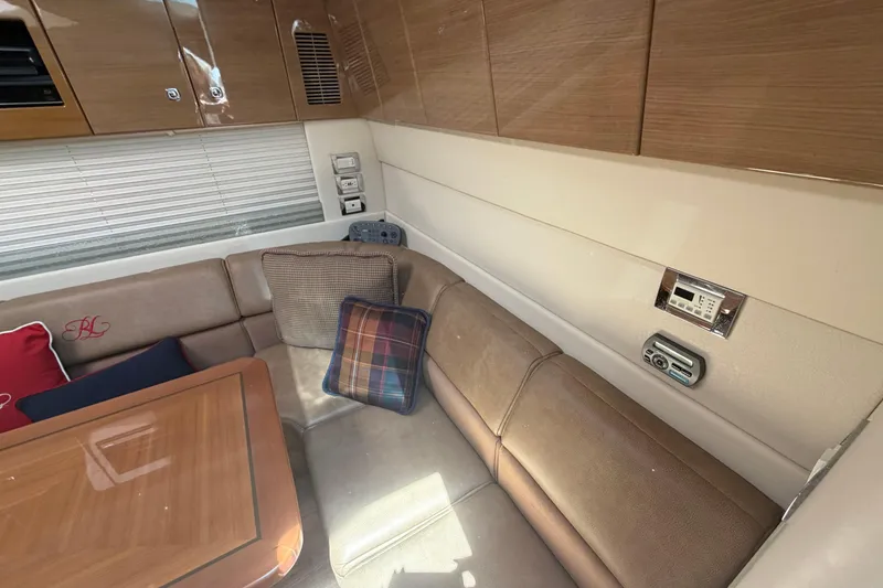 Slide: The Image of Interior of 2011 Formula 45 Yacht with cozy seating and wooden cabinetry. - 29
