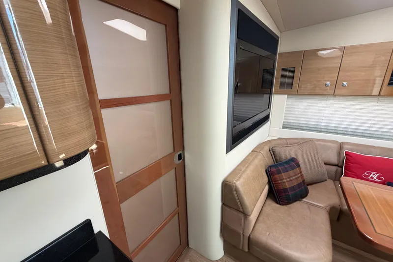 Slide: The Image of Interior of 2011 Formula 45 Yacht featuring cozy seating, wooden cabinetry, and modern design elements. - 30