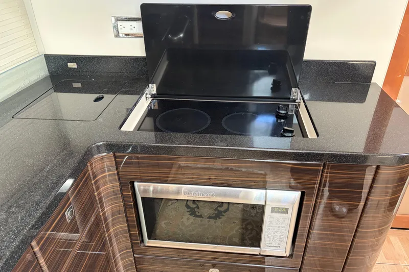 Slide: The Image of Luxury kitchen area on a 2011 Formula 45 Yacht with stove and microwave. - 31