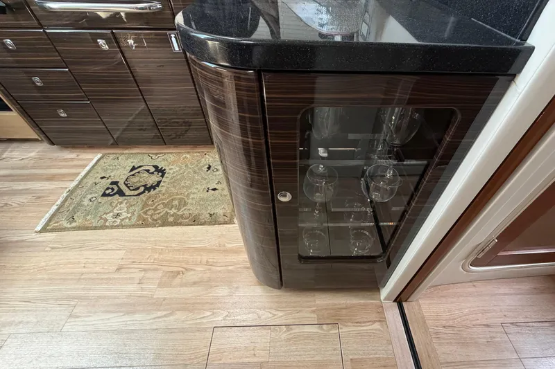 Slide: The Image of Interior of 2011 Formula 45 Yacht with elegant cabinetry and glassware storage. - 32