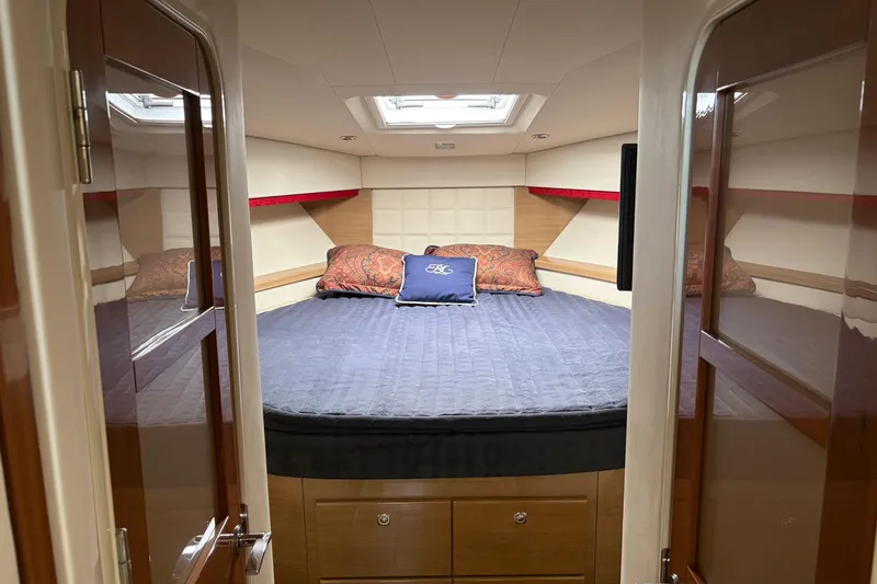 Slide: The Image of Luxurious cabin interior of a 2011 Formula 45 Yacht with plush bedding. - 34