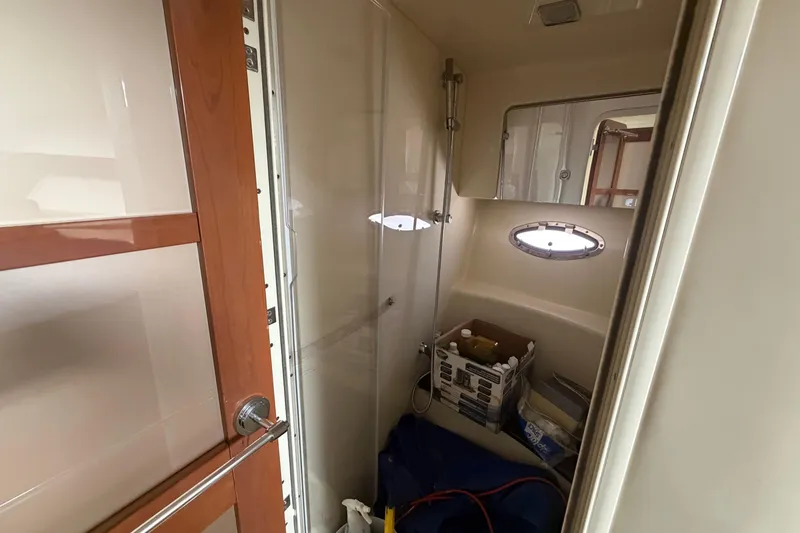 Slide: The Image of Interior of 2011 Formula 45 Yacht bathroom with shower and storage items. - 36