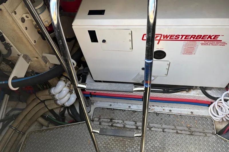 Slide: The Image of Engine room of 2011 Formula 45 Yacht with Westerbeke generator and metal ladder. - 41