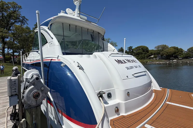 Slide: The Image of 2011 Formula 45 Yacht docked, featuring sleek design and vibrant blue accents. - 7