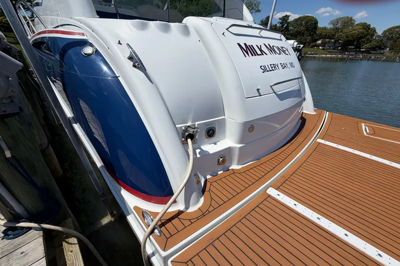 Slide: The Image of 2011 Formula 45 Yacht docked, featuring sleek design and wooden deck. - 8