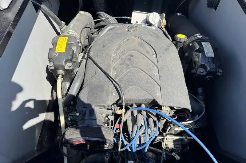 Slide: The Image of Engine of a 2007 Centurion Enzo SV216 boat, showcasing intricate components and wiring. - 10