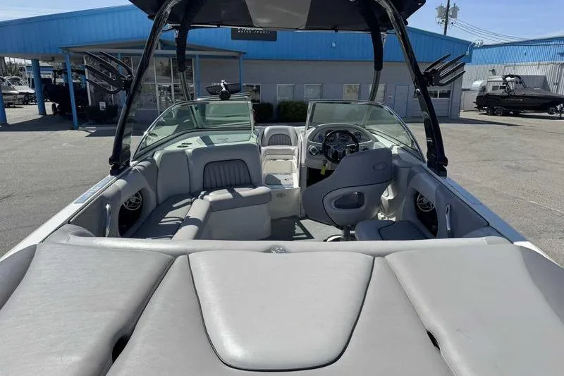 Slide: The Image of 2007 Centurion Enzo SV216 boat interior with gray seating and steering wheel. - 13