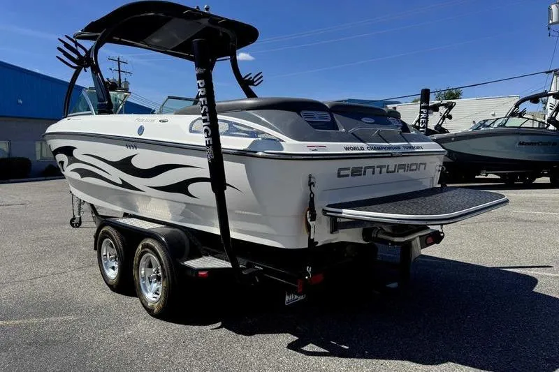 Slide: The Image of 2007 Centurion Enzo SV216 boat on trailer, featuring sleek design and graphics. - 15