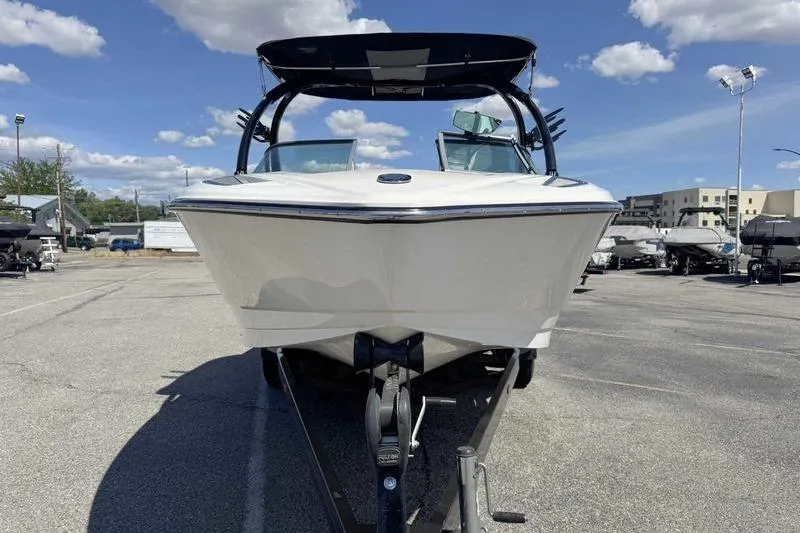 Slide: The Image of 2007 Centurion Enzo SV216 boat on trailer under blue sky. - 2
