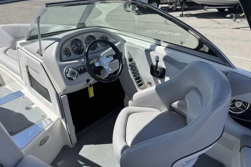Slide: The Image of 2007 Centurion Enzo SV216 boat interior with steering wheel and dashboard controls. - 3