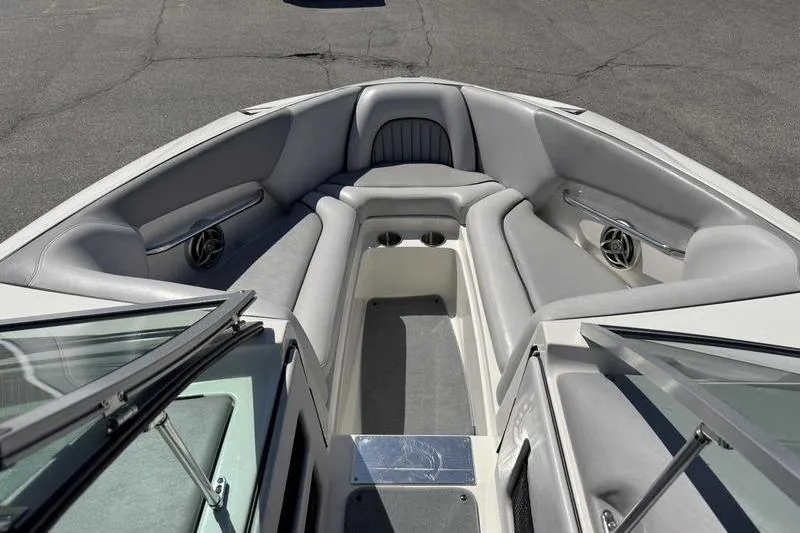 Slide: The Image of 2007 Centurion Enzo SV216 boat interior with gray seating and cup holders. - 4