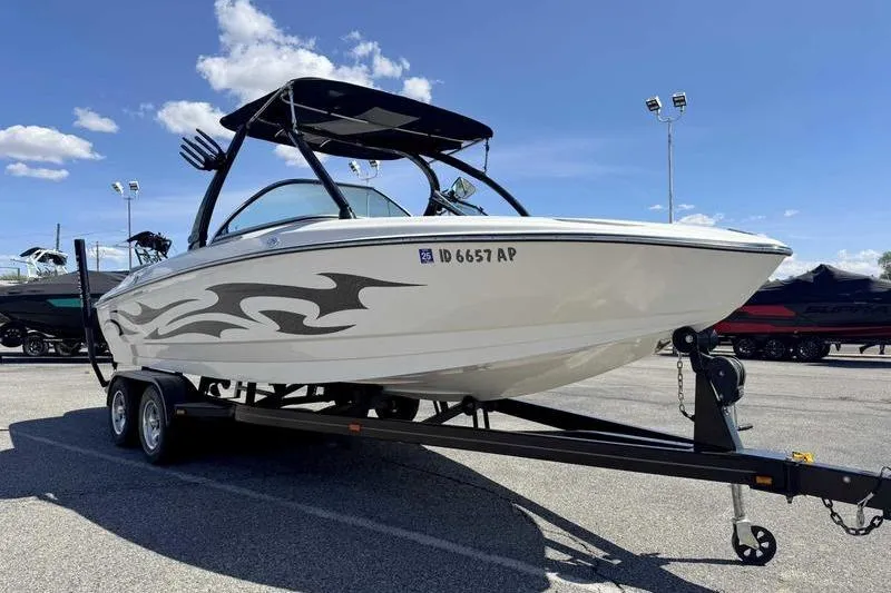 Slide: The Image of 2007 Centurion Enzo SV216 boat on trailer under clear blue sky. - 6