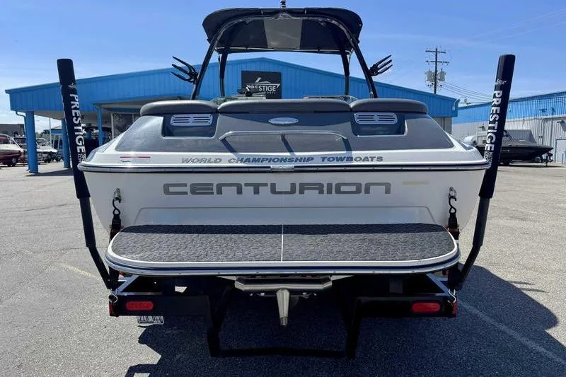 Slide: The Image of 2007 Centurion Enzo SV216 boat, rear view, parked outdoors at a dealership. - 7
