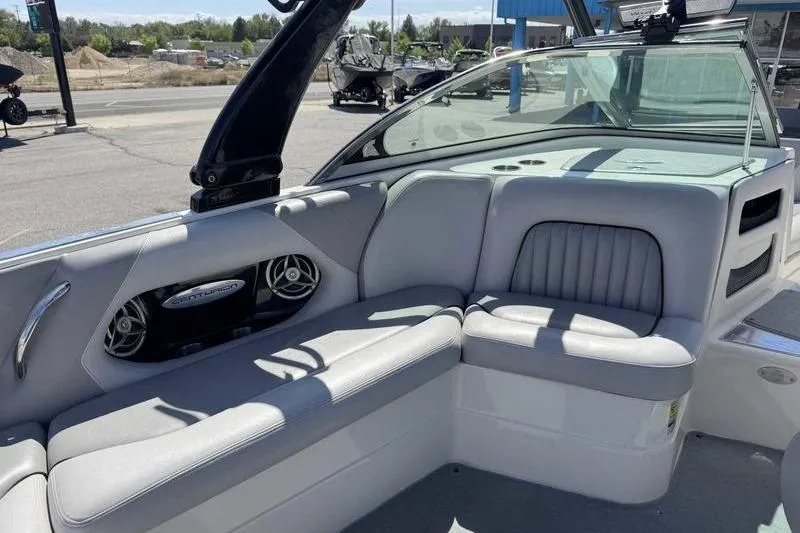 Slide: The Image of Interior of a 2007 Centurion Enzo SV216 boat with gray seating and speakers. - 8