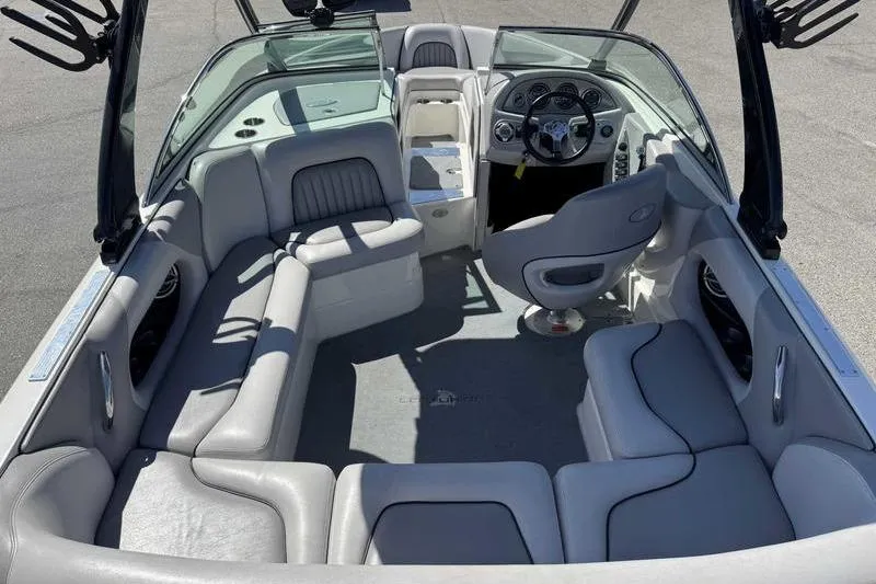 Slide: The Image of 2007 Centurion Enzo SV216 boat interior with gray seating and steering console. - 9