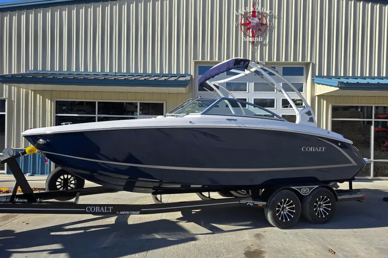 Slide: The Image of 2020 Cobalt R3 boat on trailer outside a marine building. - 1