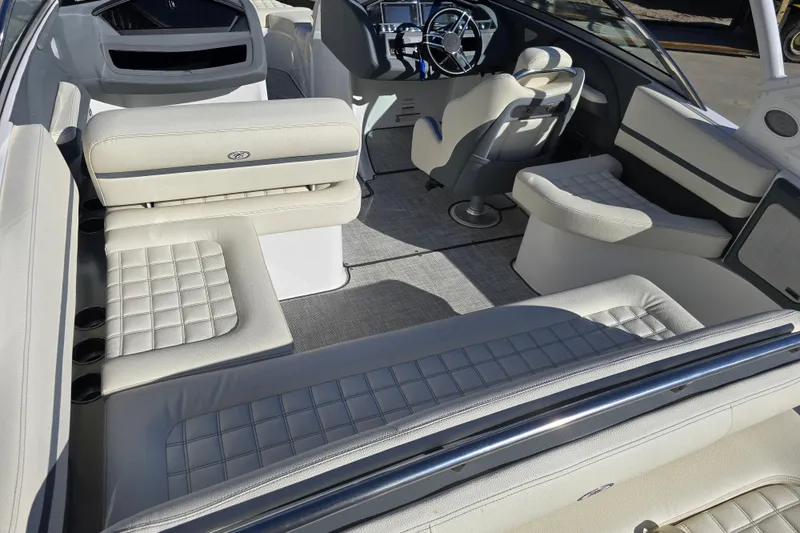 Slide: The Image of 2020 Cobalt R3 boat interior with luxurious white seating and modern dashboard. - 10