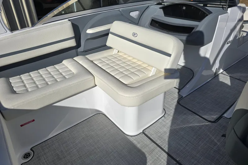 Slide: The Image of Interior seating of a 2020 Cobalt R3 boat with cushioned upholstery. - 11