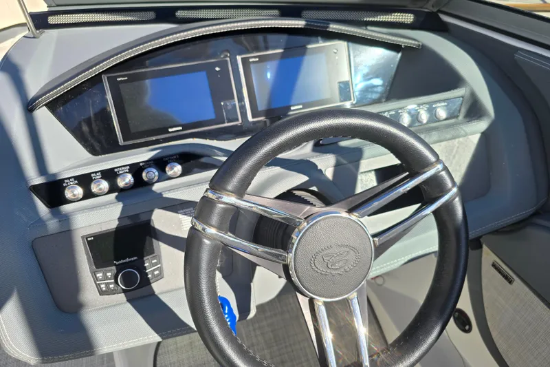 Slide: The Image of 2020 Cobalt R3 boat dashboard with steering wheel and digital displays. - 14