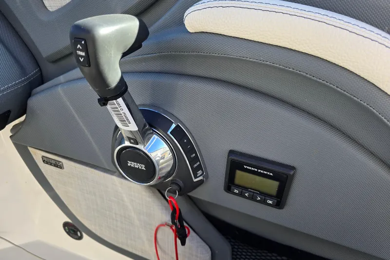 Slide: The Image of Volvo Penta throttle control on 2020 Cobalt R3 boat dashboard, featuring trim buttons and display. - 15