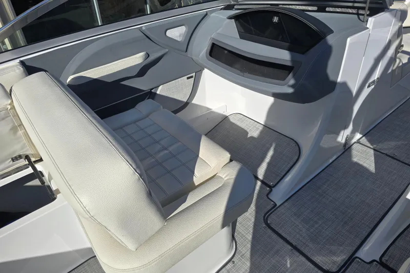 Slide: The Image of Interior of a 2020 Cobalt R3 boat featuring seating and dashboard details. - 16