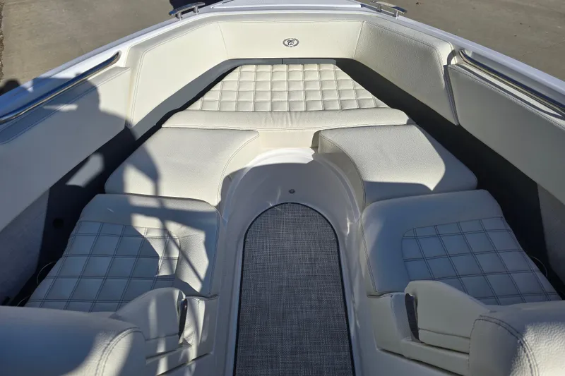 Slide: The Image of 2020 Cobalt R3 boat interior with white cushioned seating and elegant design. - 17