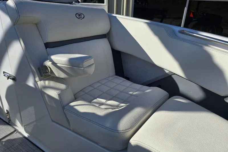 Slide: The Image of Luxurious seating in 2020 Cobalt R3 boat, featuring plush white upholstery and armrest. - 21