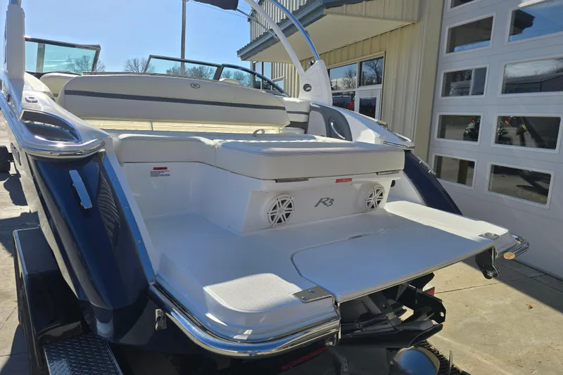 Slide: The Image of 2020 Cobalt R3 boat with spacious seating and sleek design in a sunny outdoor setting. - 3