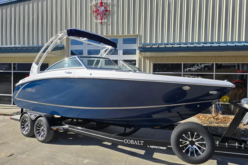 Slide: The Image of 2020 Cobalt R3 boat on trailer outside a marine dealership. - 8