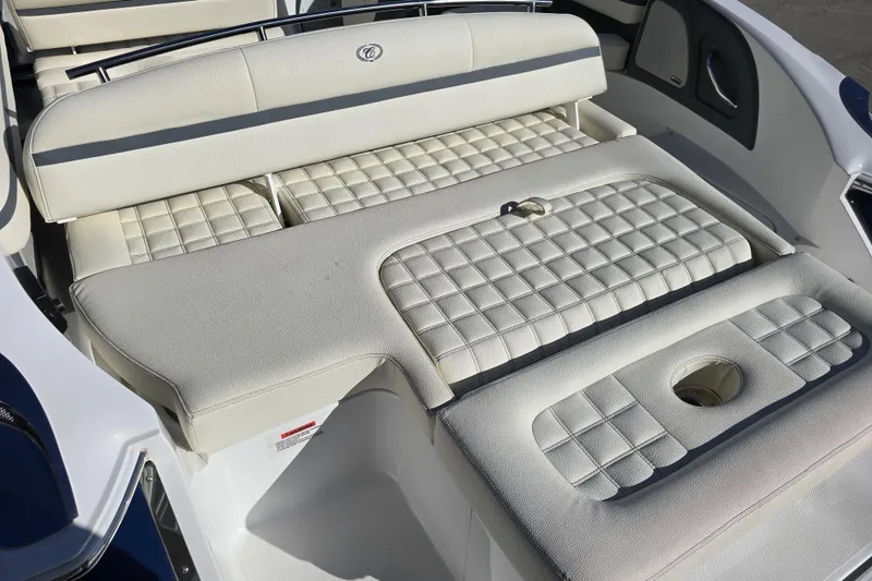 Slide: The Image of 2020 Cobalt R3 boat interior with white cushioned seating and quilted design. - 9