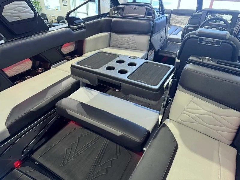 Slide: The Image of 2025 Supra SA interior with luxurious seating and integrated cup holders. - 14