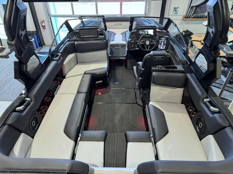 Slide: The Image of 2025 Supra SA boat interior with luxurious seating and modern dashboard design. - 7