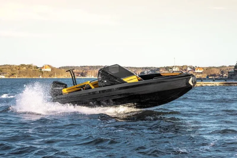 The Image of High-speed Iron 767 boat cruising on water, 2026 model, with scenic coastal background. - 1