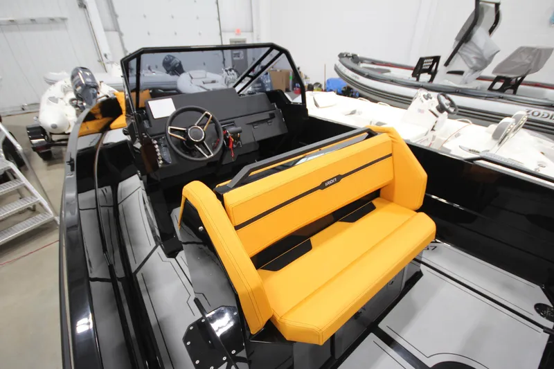 Slide: The Image of Modern Iron 767 boat interior with yellow seating and sleek dashboard, 2026 model. - 17