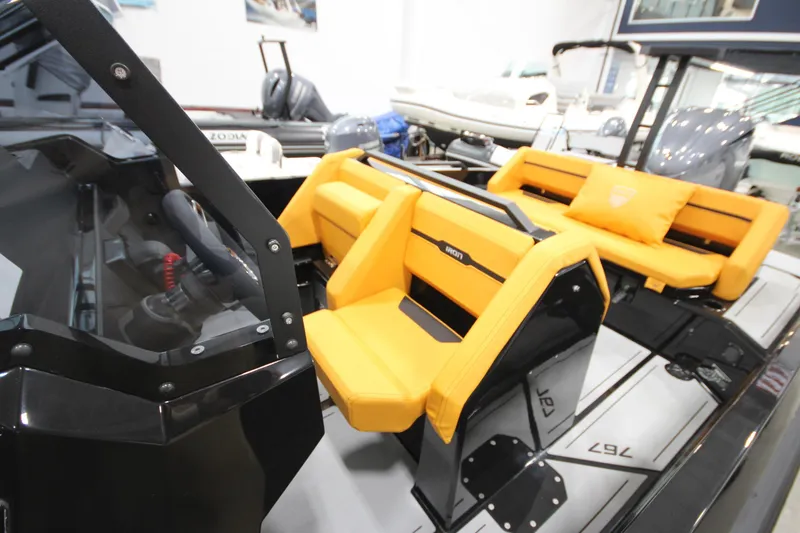 Slide: The Image of Interior of Iron 767 boat, featuring modern yellow seating and sleek design, 2026 model. - 18